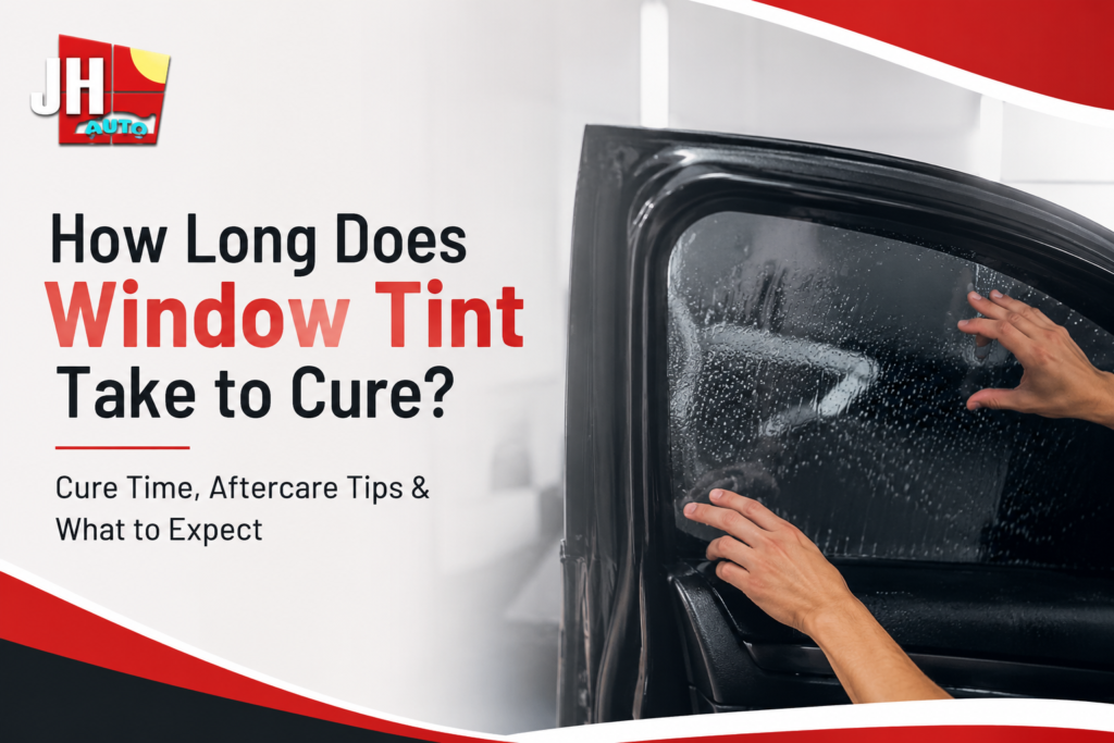 Professional window tint installation on a car window by JH Auto